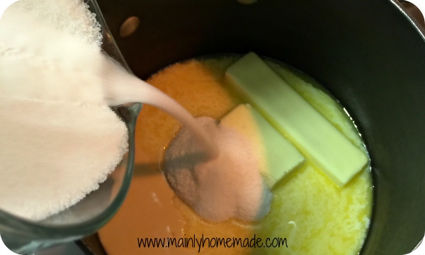 Melting butter and sugar for homemade fudge recipe