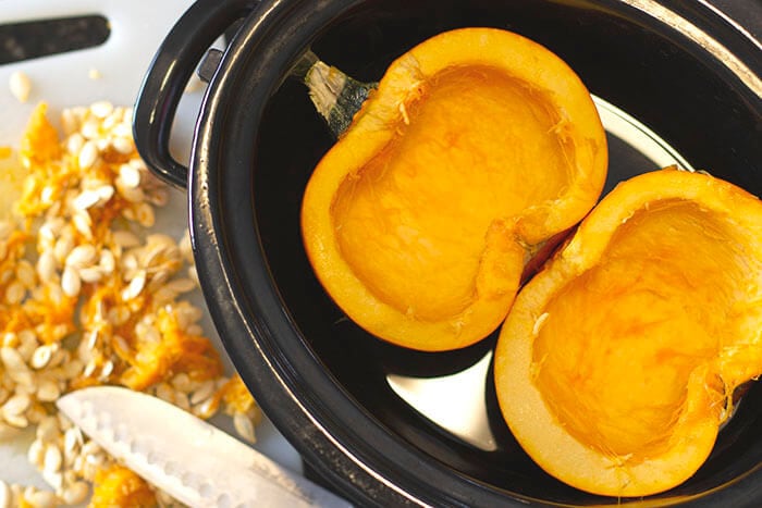 How to cook a whole pumpkin in a slow cooker. Easy prep directions for easy pumpkin puree with very little effort.
